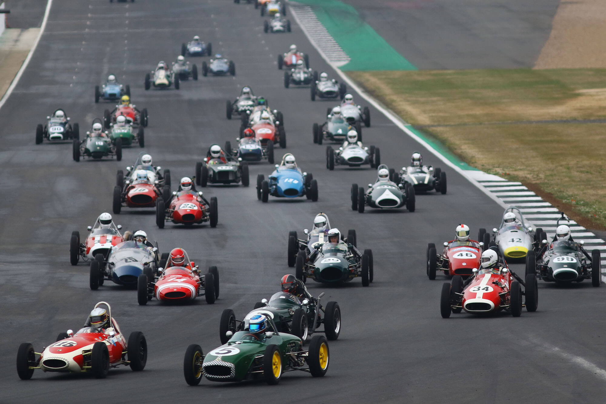 Formula Junior cars racing on the Silverstone Circuit at The Classic