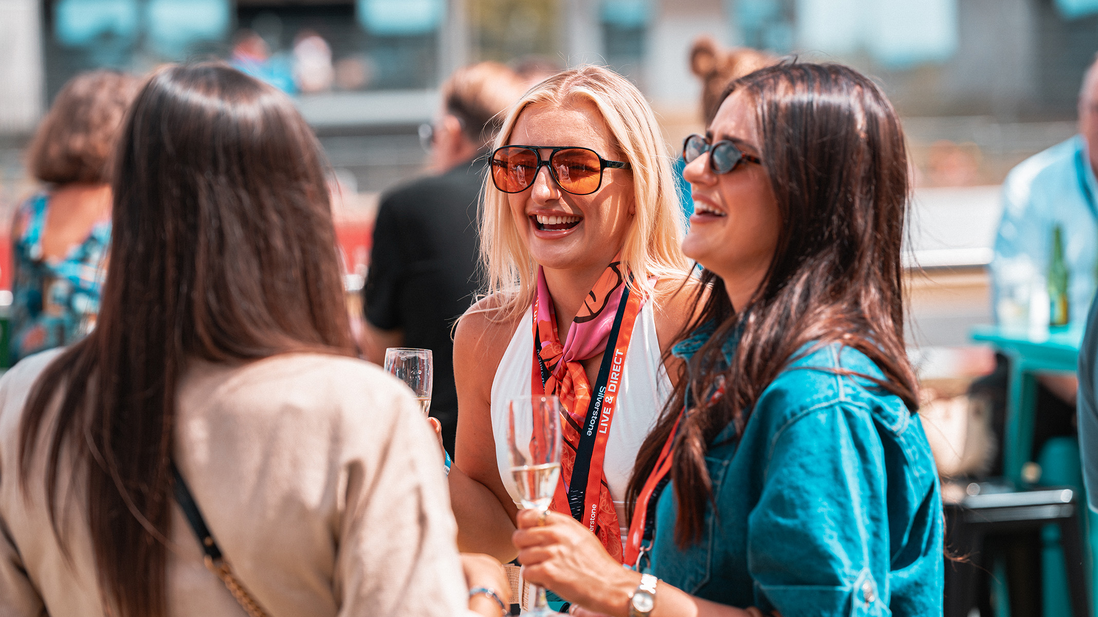 A group celebrating in a hospitality space at Silverstone