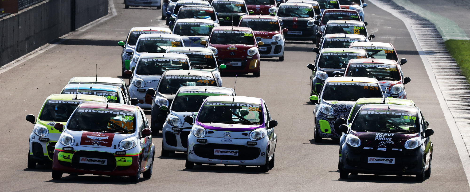 Citroën C1 endurance race cars competing in close formation at Silverstone