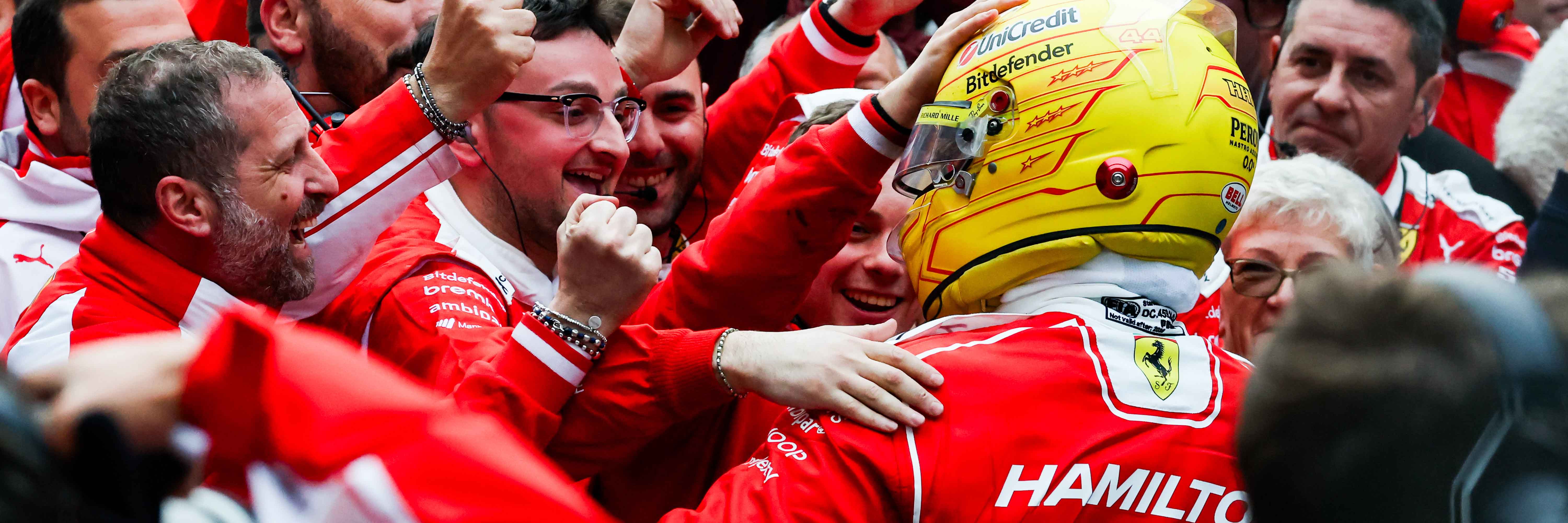 Lewis Hamilton celebrates with the Ferrari F1 team after his 2026 Chinese Grand Prix podium