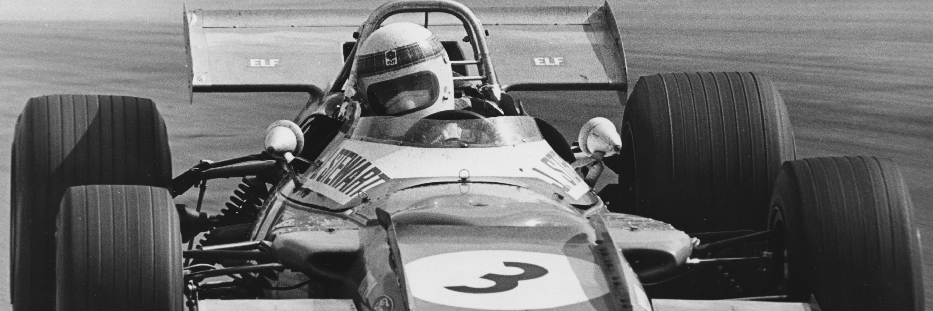 Jackie Stewart driving a classic F1 car