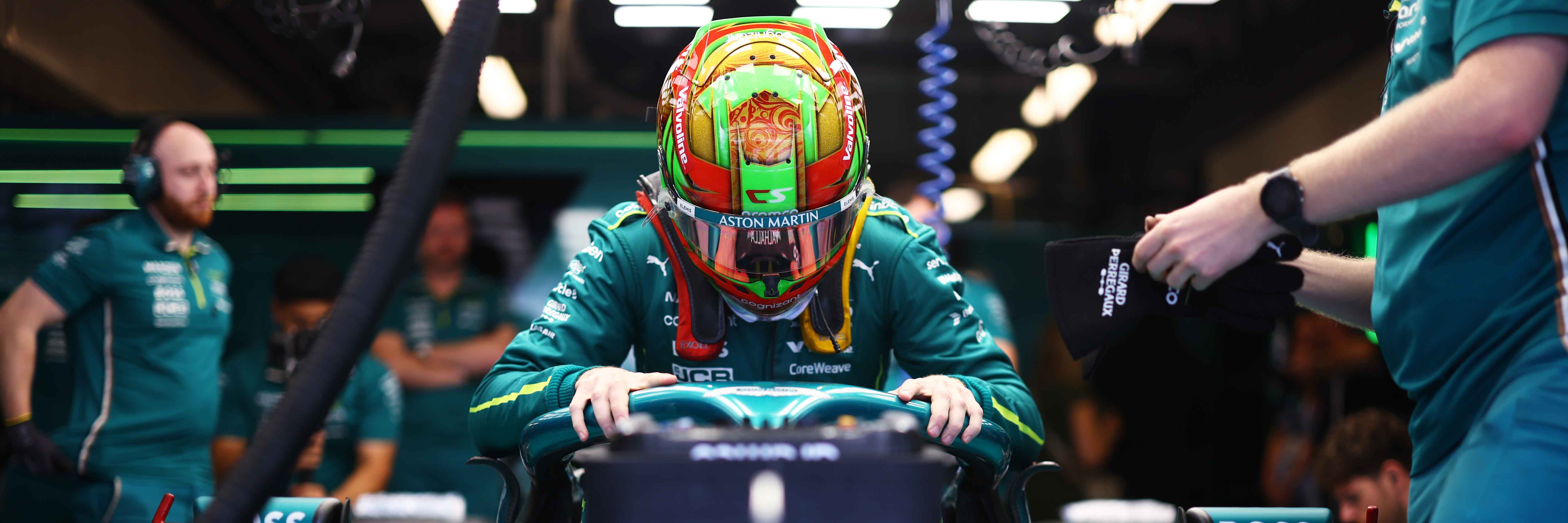 Cian Shields getting into an Aston Martin F1 car