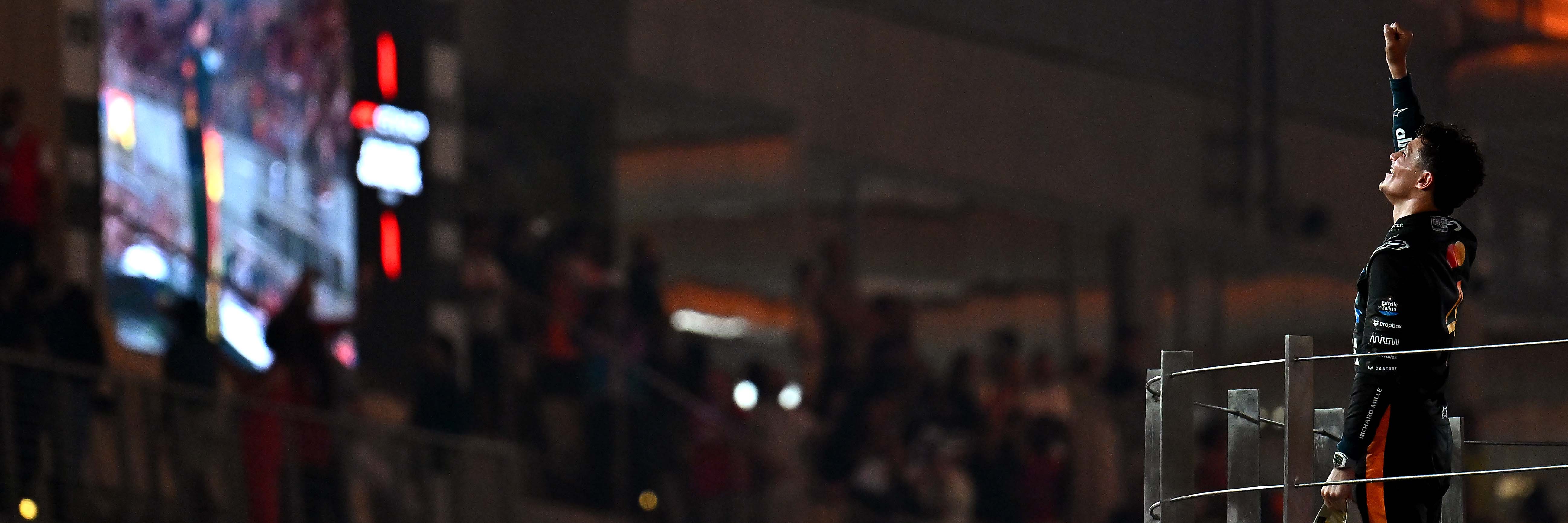 Lando Norris on the podium of the 2025 Abu Dhabi Grand Prix after winning the title