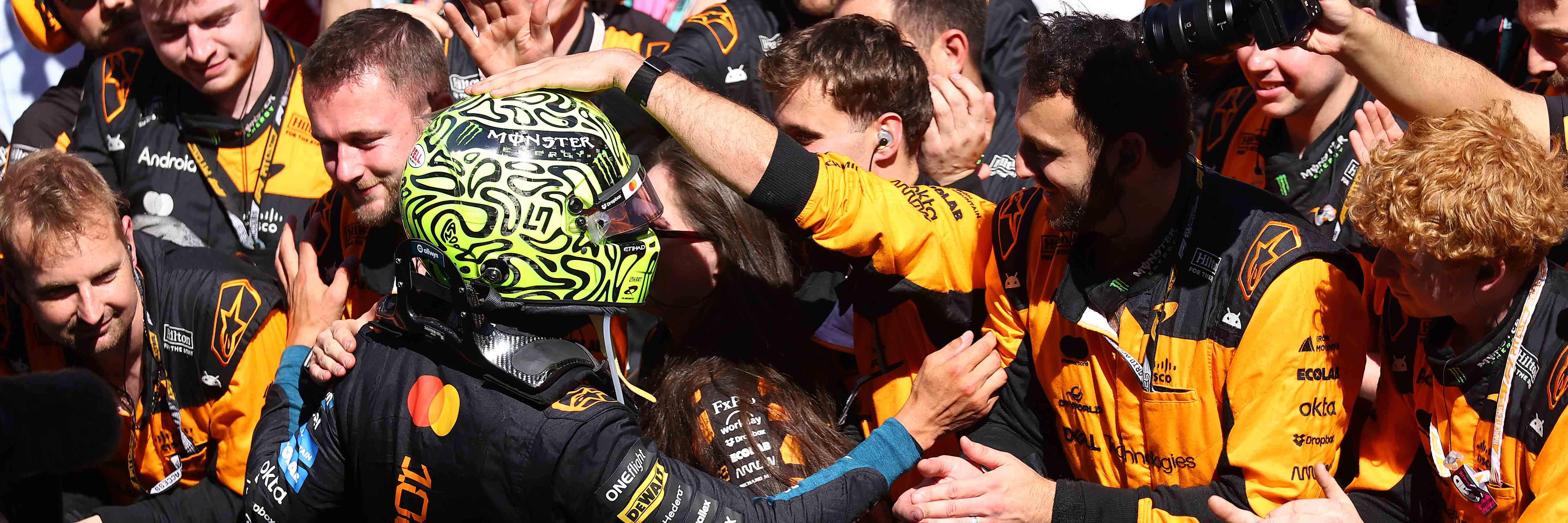 Lando Norris celebrating with the McLaren team in Barcelona