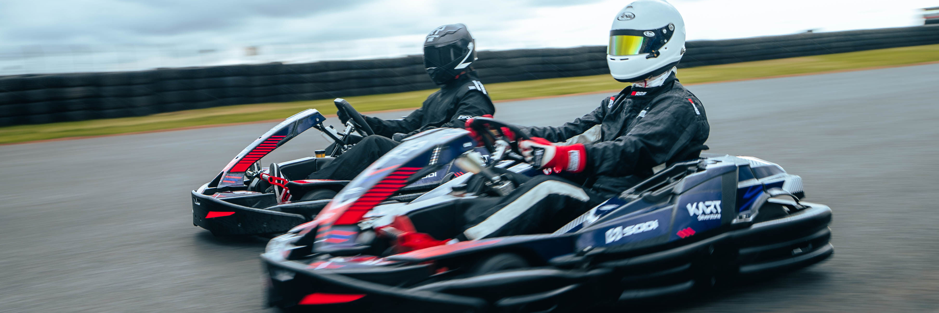 Drivers racing side-by-side at Kart Silverstone