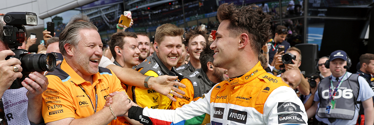 Lando Norris and Zak Brown celebrating 2nd place at the 2023 British Grand Prix