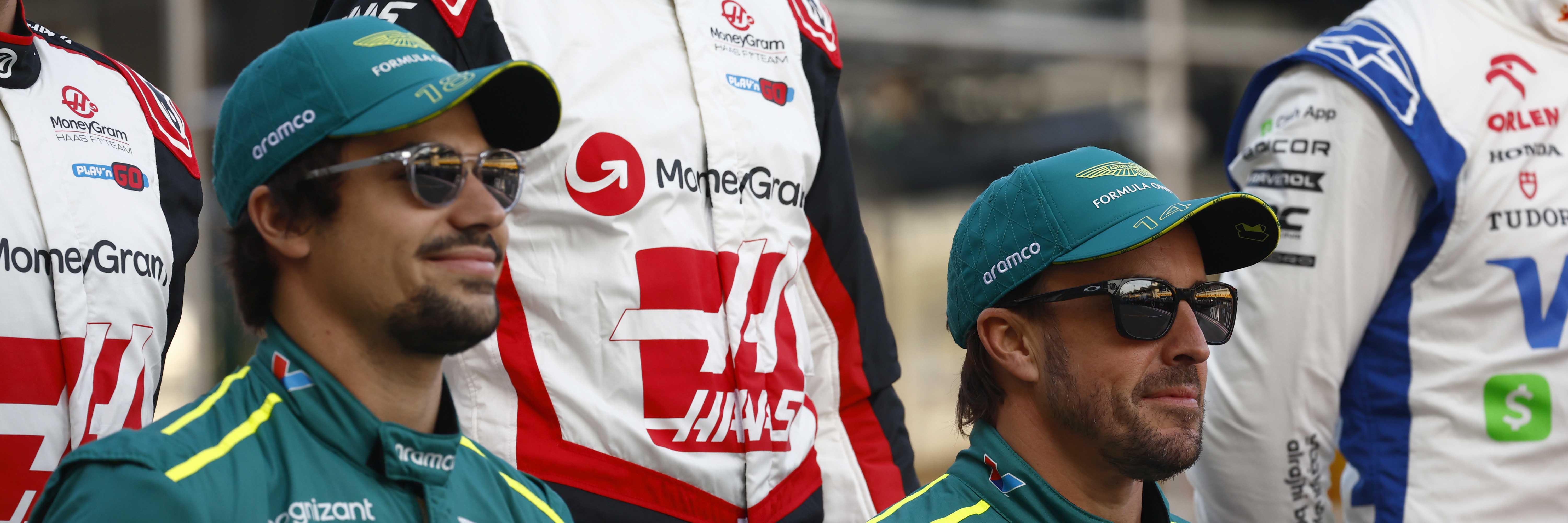 Lance Stroll and Fernando Alonso in Aston Martin caps