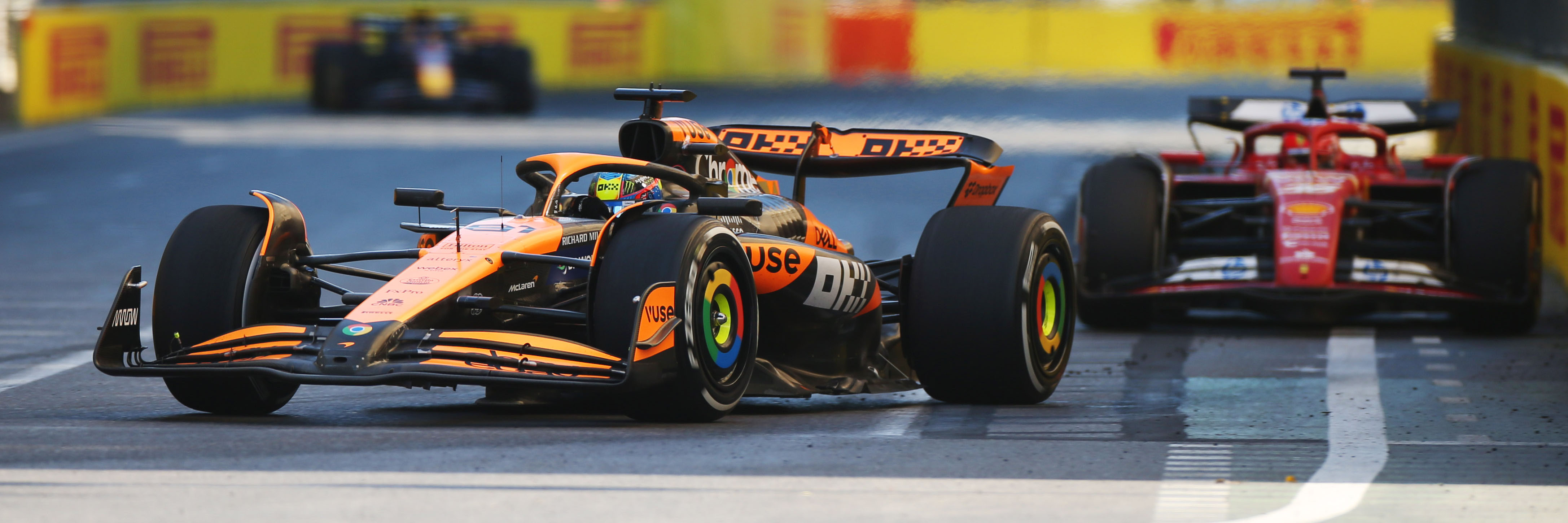 McLaren's Oscar Piastri and Ferrari's Charles Leclerc racing in F1 2024