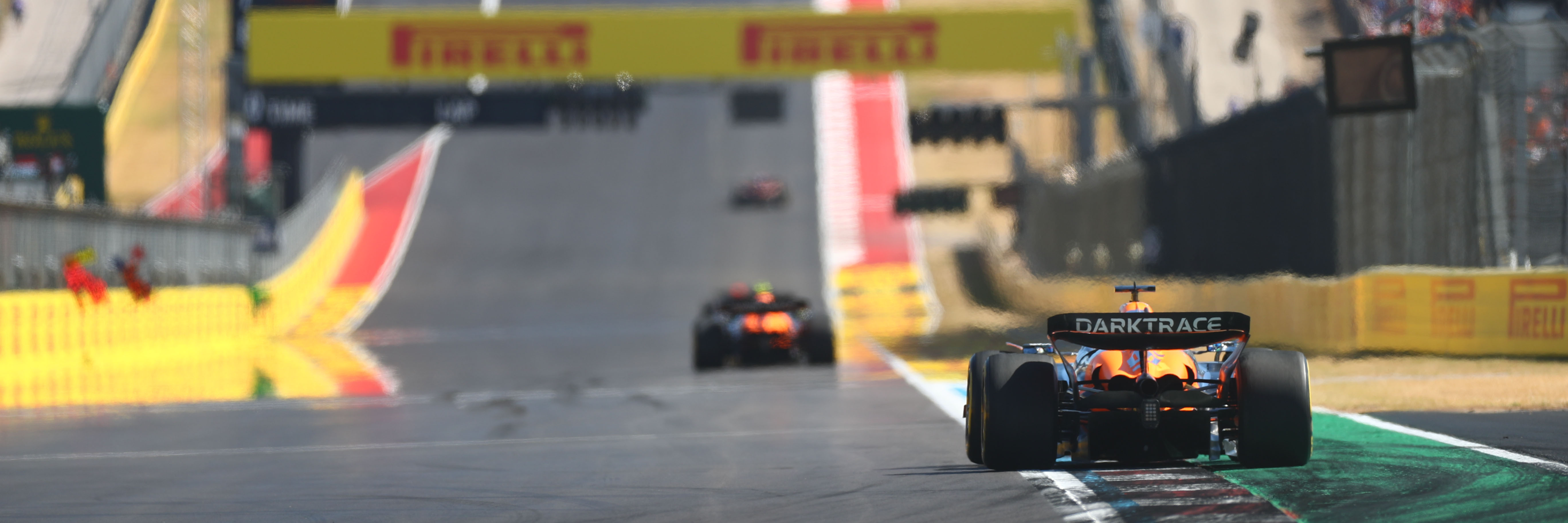 A McLaren F1 car racing at the United States Grand Prix