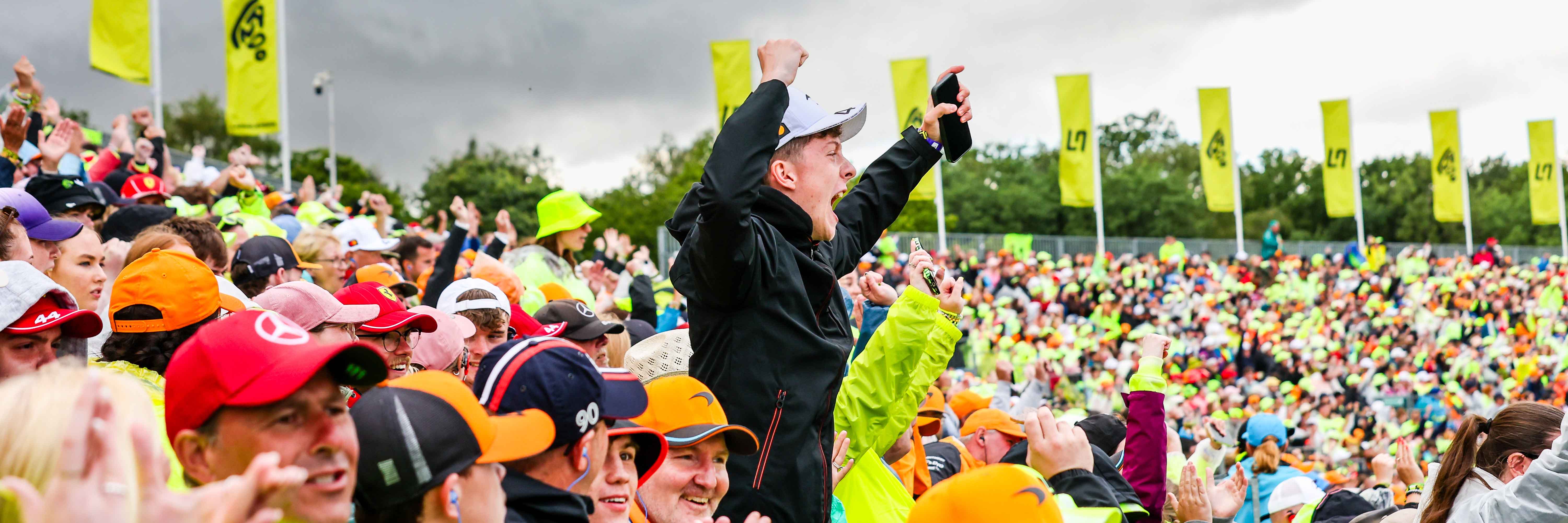 An F1 fan in the Landostand at the British Grand Prix