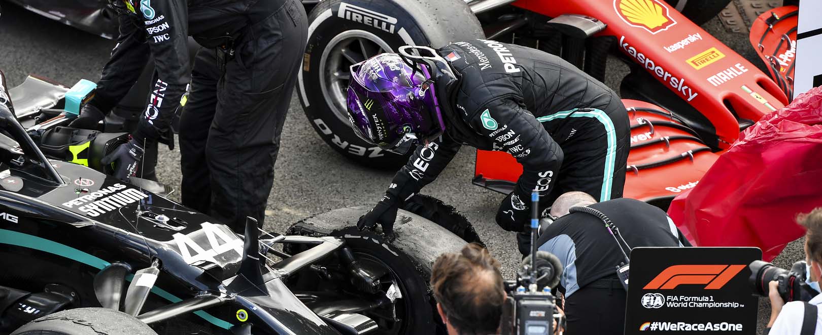 Lewis Hamilton examining his tyre after a puncture at the end of the 2020 British Grand Prix