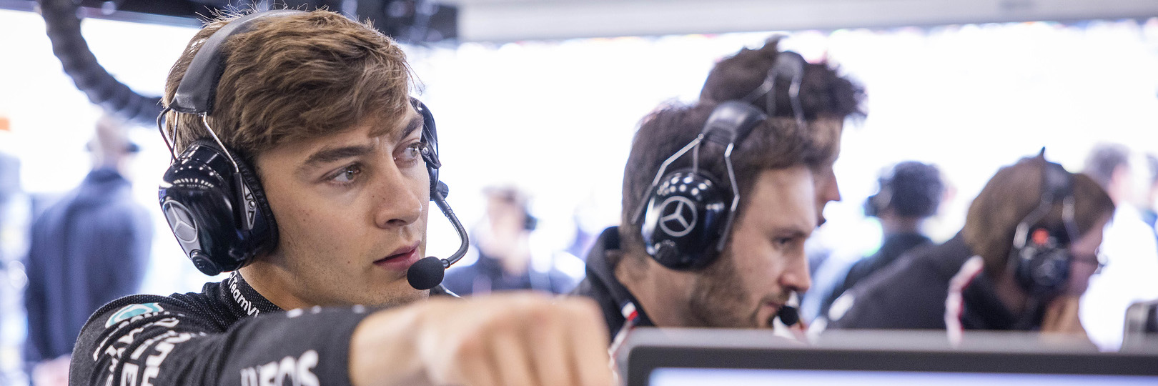 George Russell talking to his engineers in the F1 garage