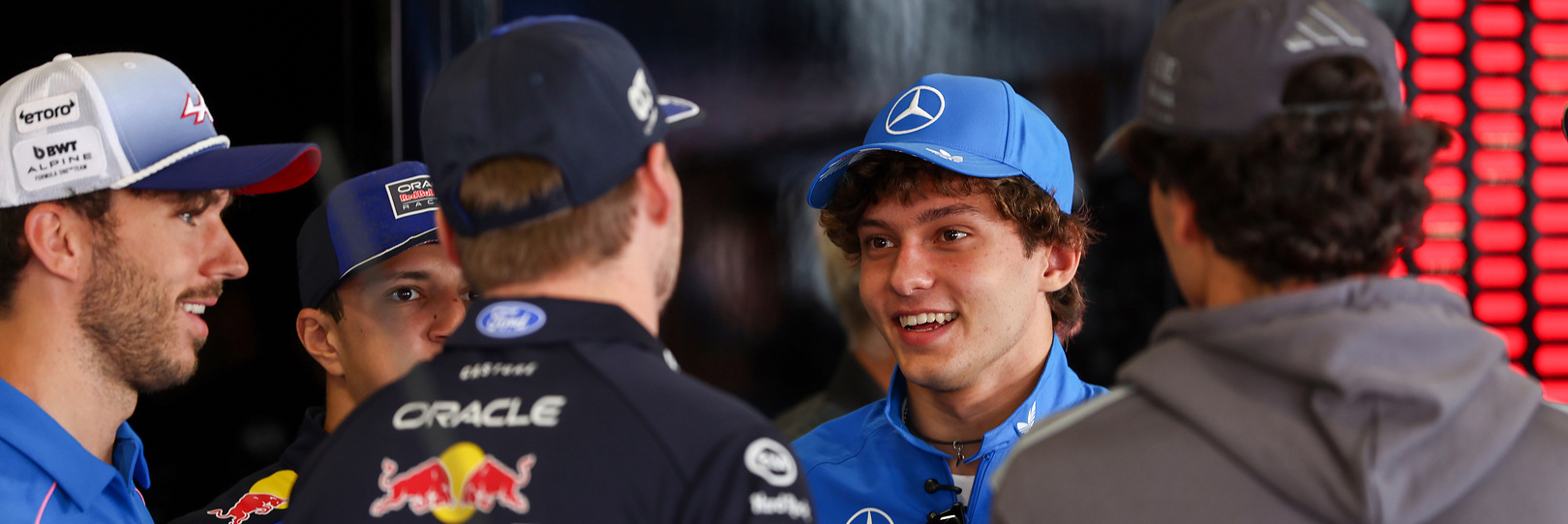 Kimi Antonelli in the F1 paddock with other drivers