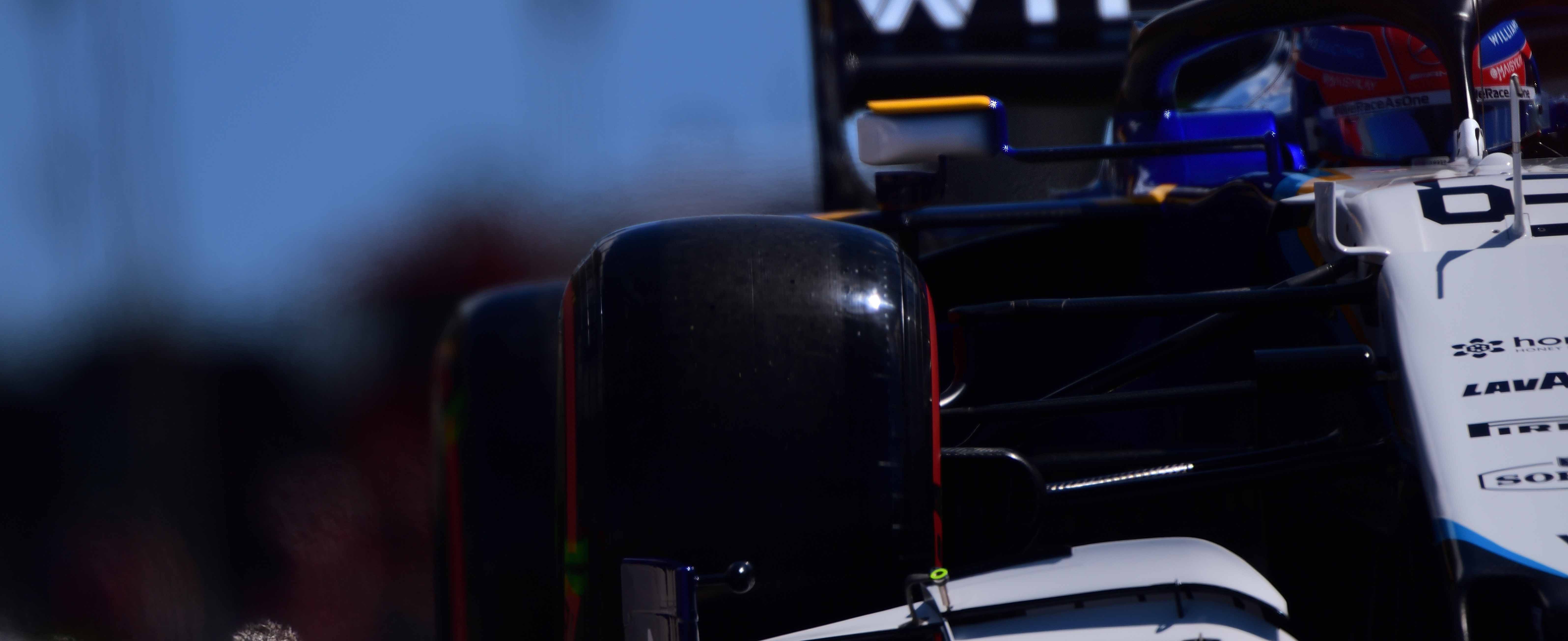 A close up of George Russell in a Williams F1 car