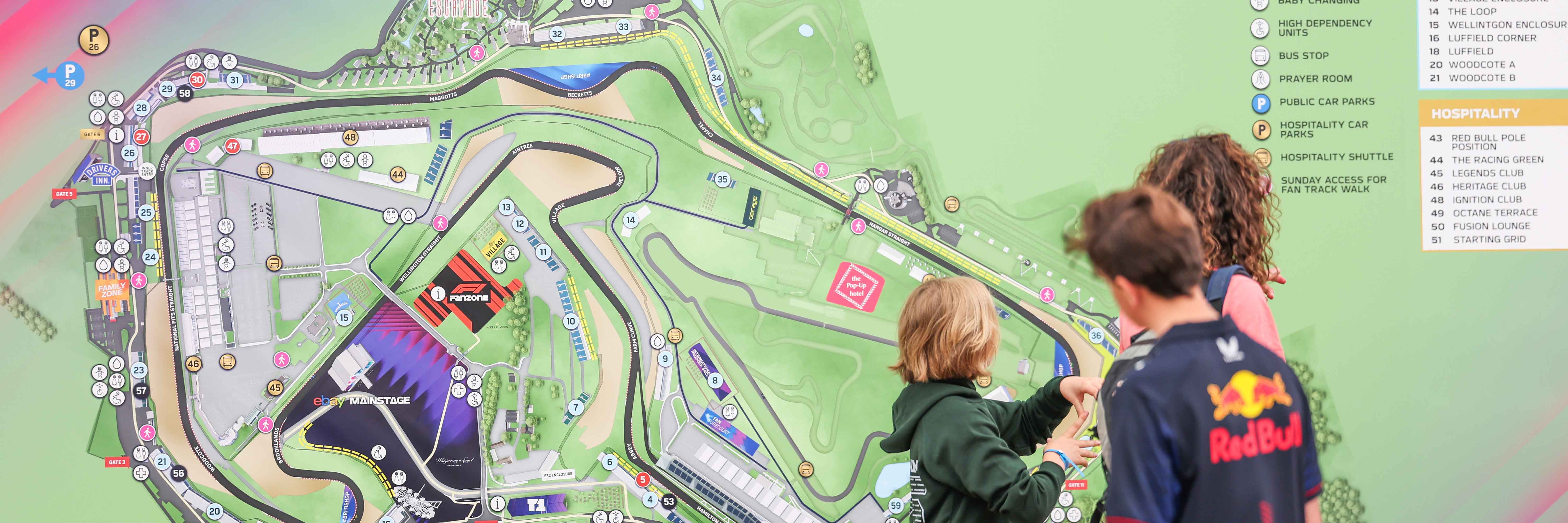 F1 fans looking at a map of Silverstone for the British Grand Prix