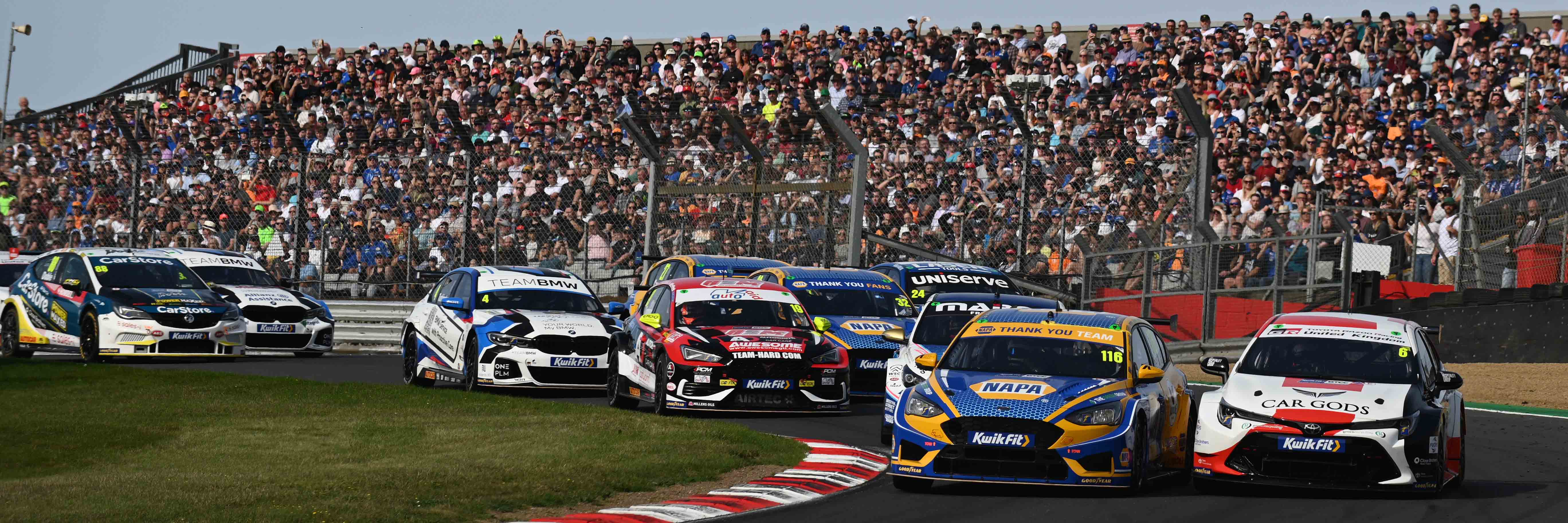 Ash Sutton and Rory Butcher go wheel to wheel for the lead at Brands Hatch