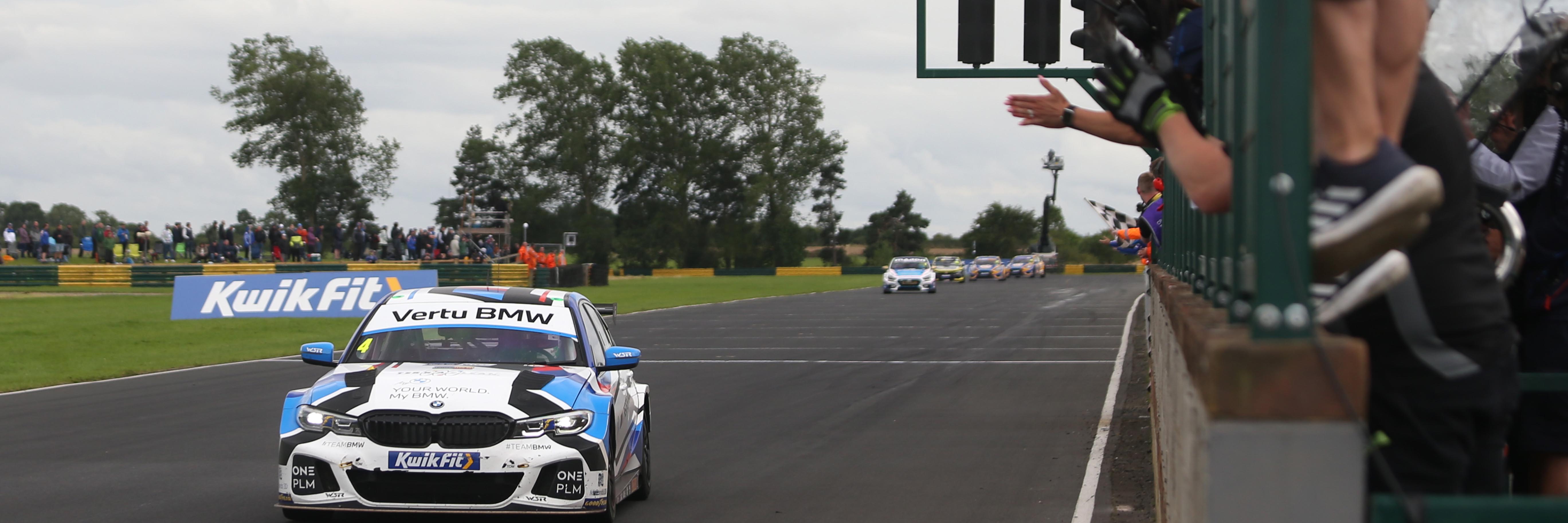 Colin Turkington crossing the line to win his 66th BTCC race