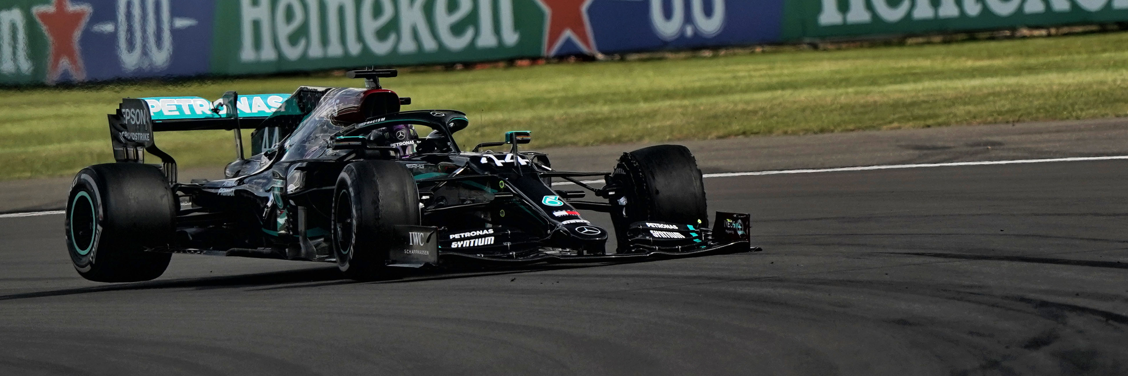 Lewis Hamilton crosses the line first with a puncture at the 2020 race at Silverstone