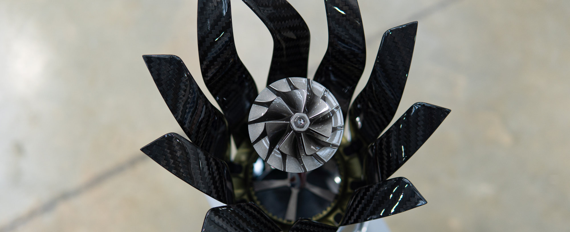 The turbocharger impeller within the Constructors’ trophy, in graphite colour. The first place trophy has a gold colour, second place silver, and third place bronze.