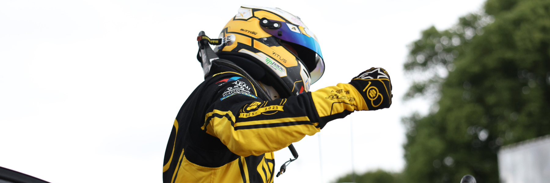Ash Sutton celebrates winning a BTCC race at Oulton Park