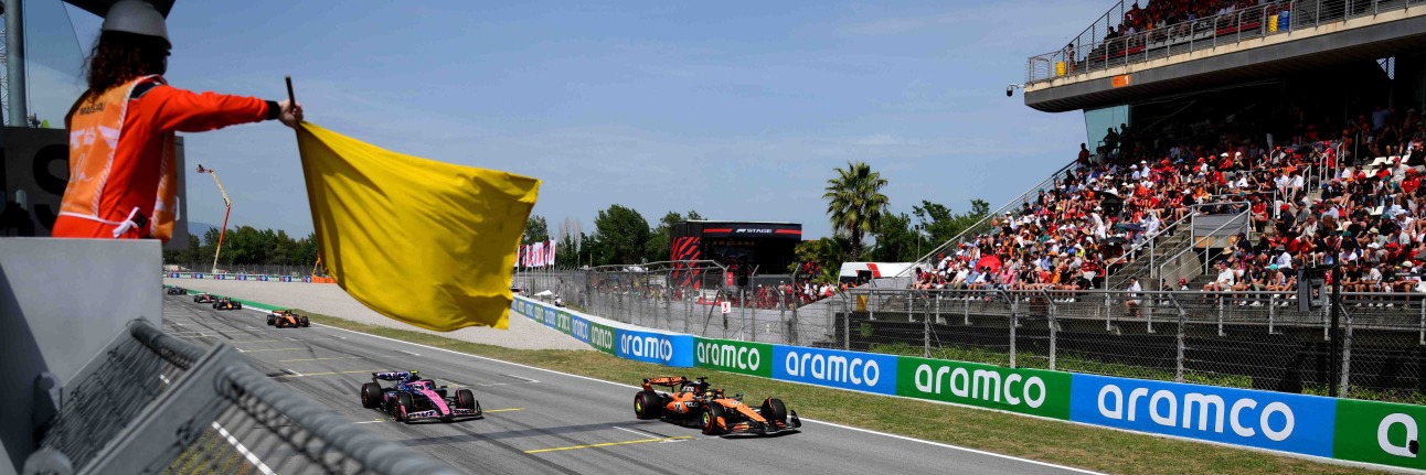 A yellow flag being waved during an F1 race