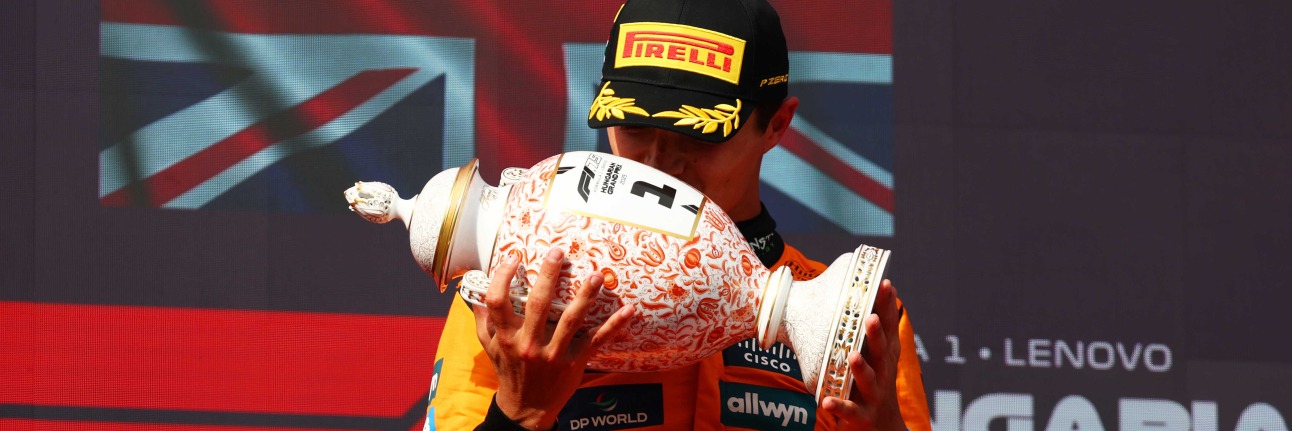 Lando Norris kisses the winners trophy for the 2025 Hungarian Grand Prix