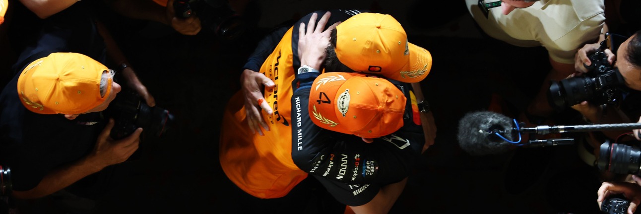 Lando Norris with the McLaren F1 team after winning the 2025 title