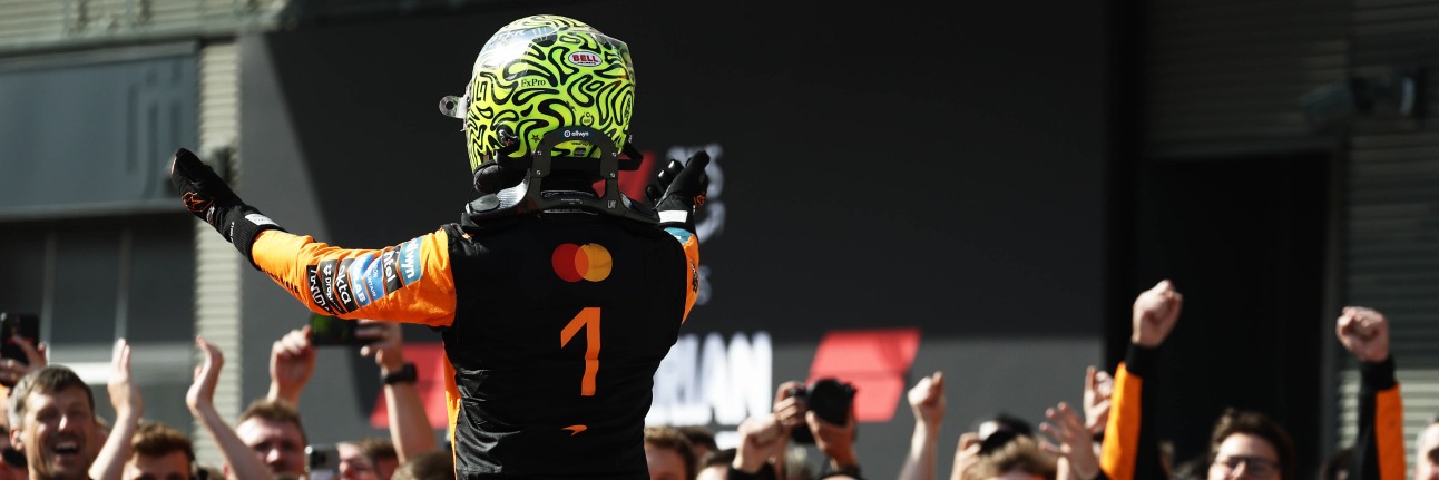Lando Norris celebrates winning the 2026 Hungarian Grand Prix in front of his McLaren F1 team