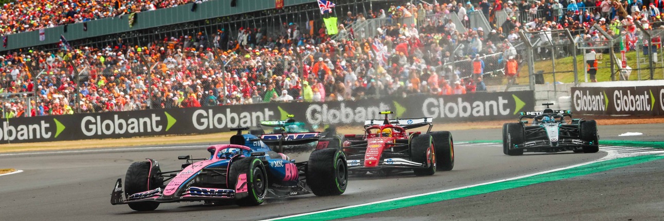 An Alpine F1 car racing Lewis Hamilton at the British Grand Prix