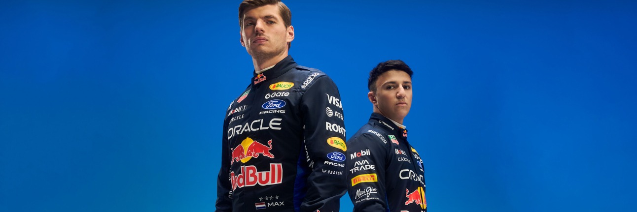 battles in f1 between team mates max verstappen and isack hadjar stand back-to-back looking at the camera. 