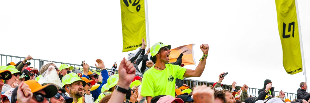 An F1 fan in the Landostand grandstand at the British Grand Prix