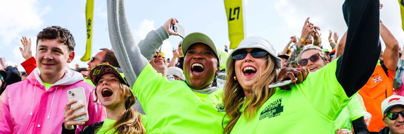 Lando Norris fans celebrating the McLaren drivers win at the British Grand Prix