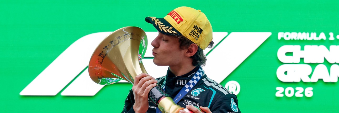 Kimi Antonelli kissing his 2026 Chinese Grand Prix trophy