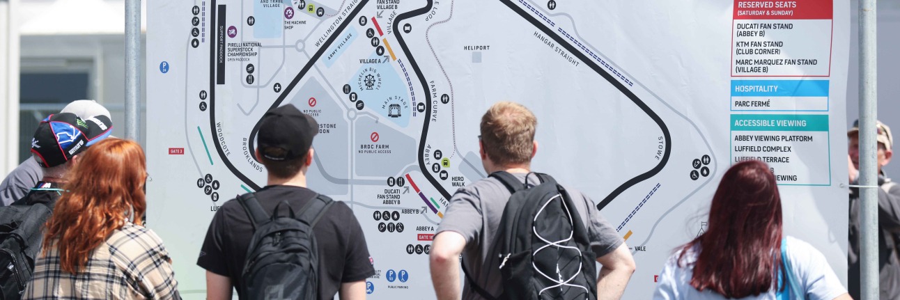 MotoGP fans looking over the circuit map at Silverstone