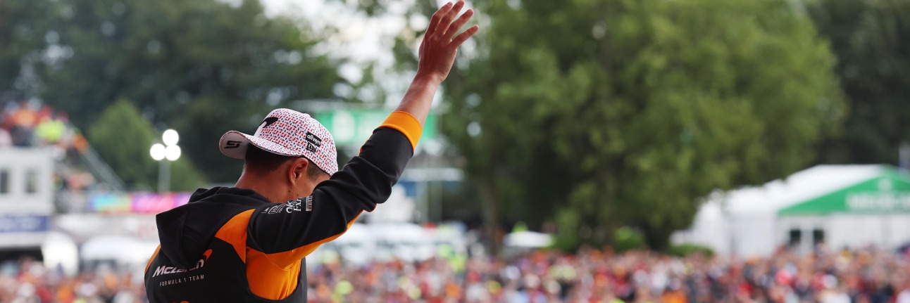 Lando Norris in front of the 2025 British Grand Prix crowd after winning at Silverstone