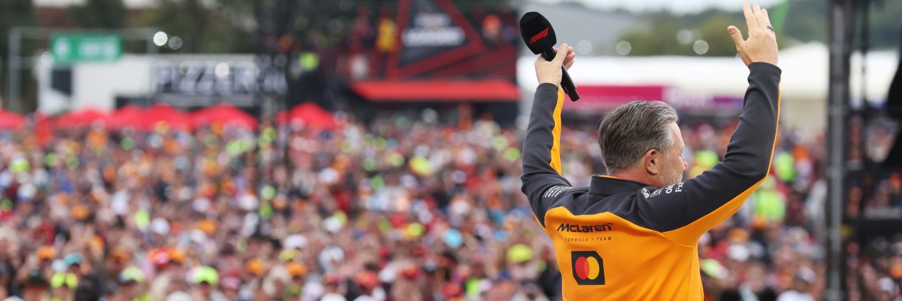 Zak Brown talking to the Silverstone crowd at the 2026 British Grand Prix