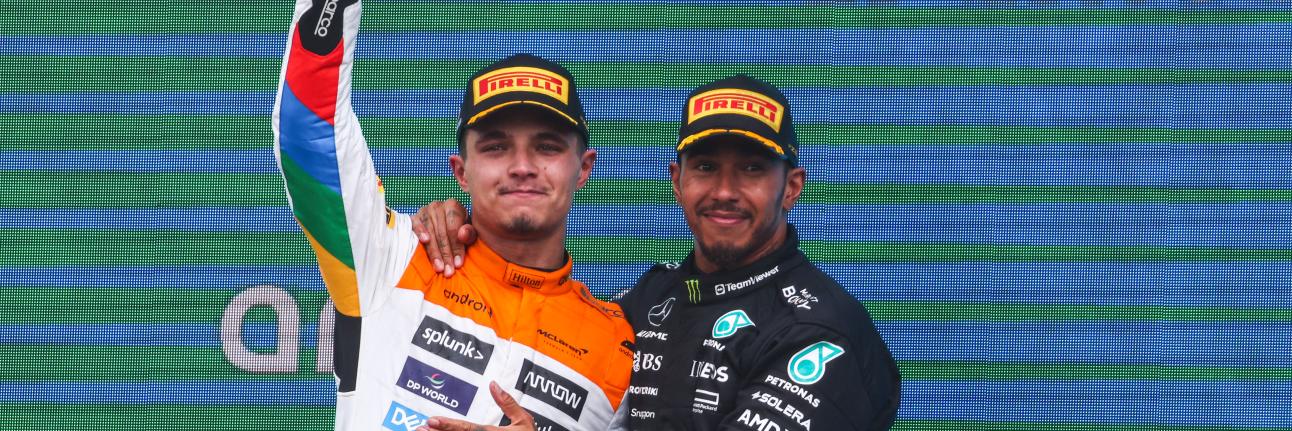 Lando Norris and Lewis Hamilton on the podium for the British Grand Prix