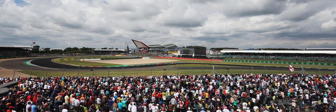 Formula 1 wide angle photo with fans watching the track