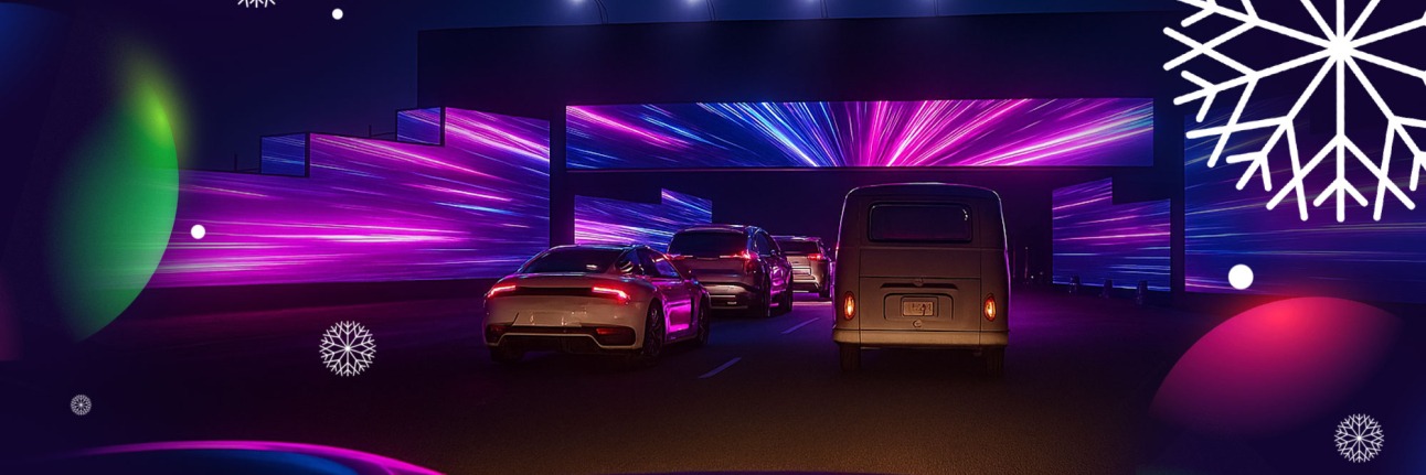 lap of lights visual showing cars driving under a tunnel of light. 