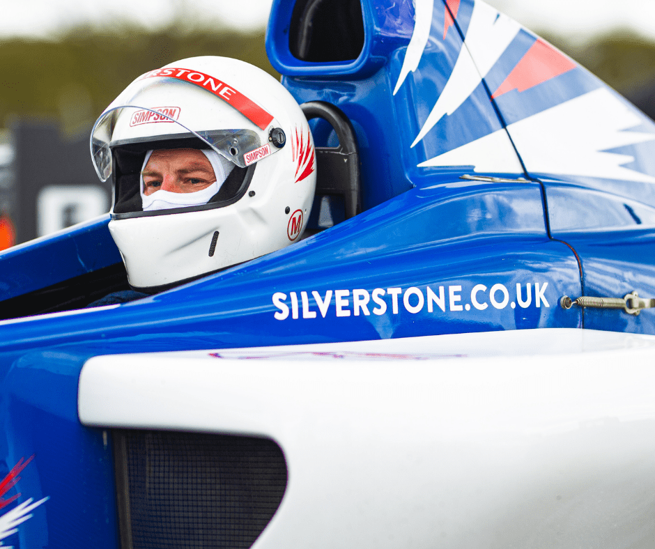Formation of Formula Silverstone Single Seaters taking on the iconic track
