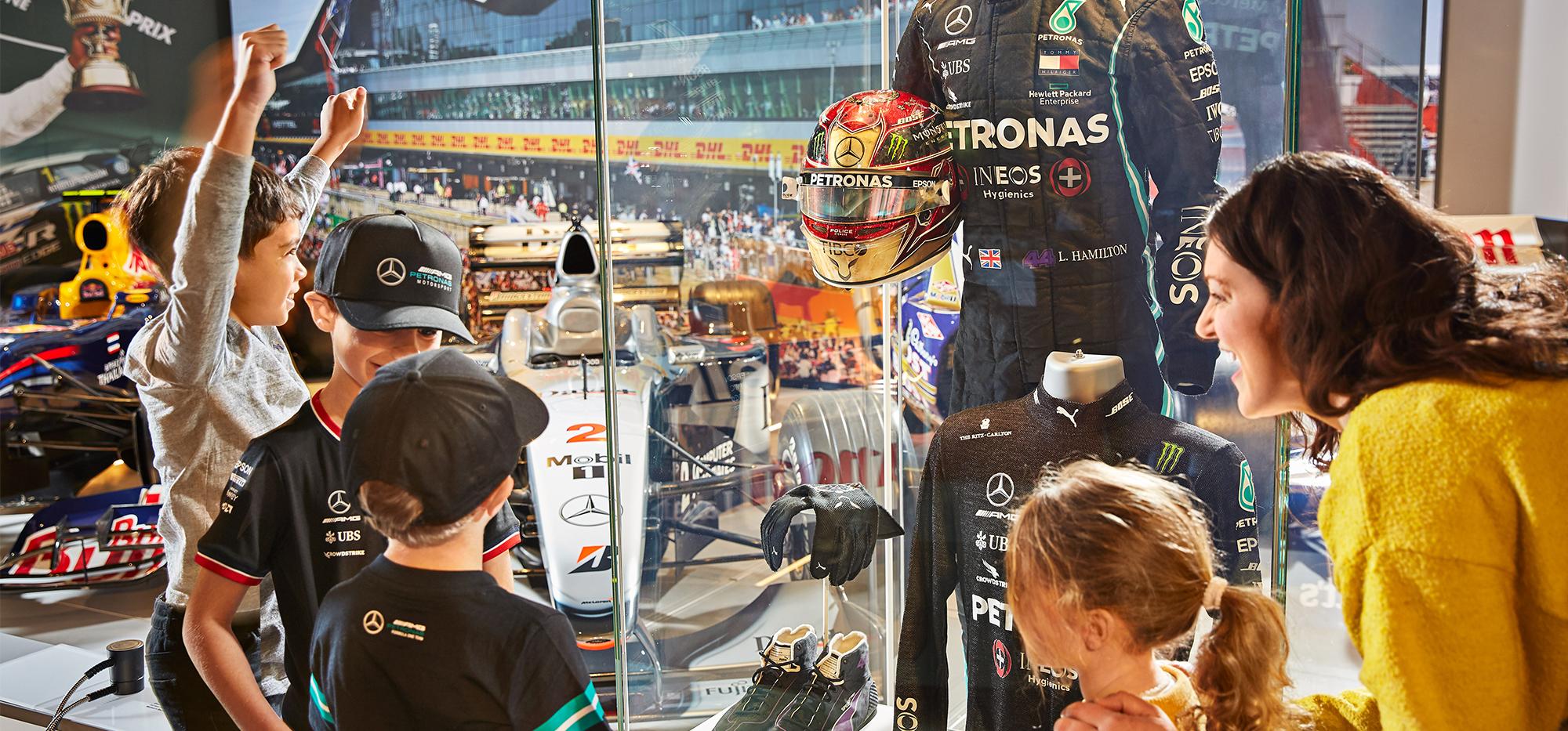 family looking at exhibition inside the Silverstone Interactive Museum 