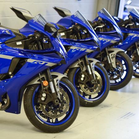 Yamaha R1M's lined up in Silverstone garage