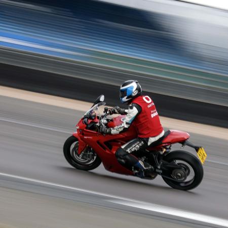 Rider on track at speed at Silverstone