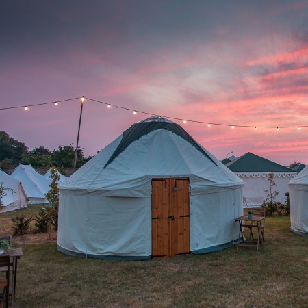 glamping round tent with sunset sky