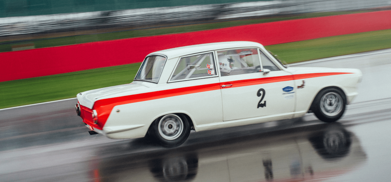 motor racing legend cars on track