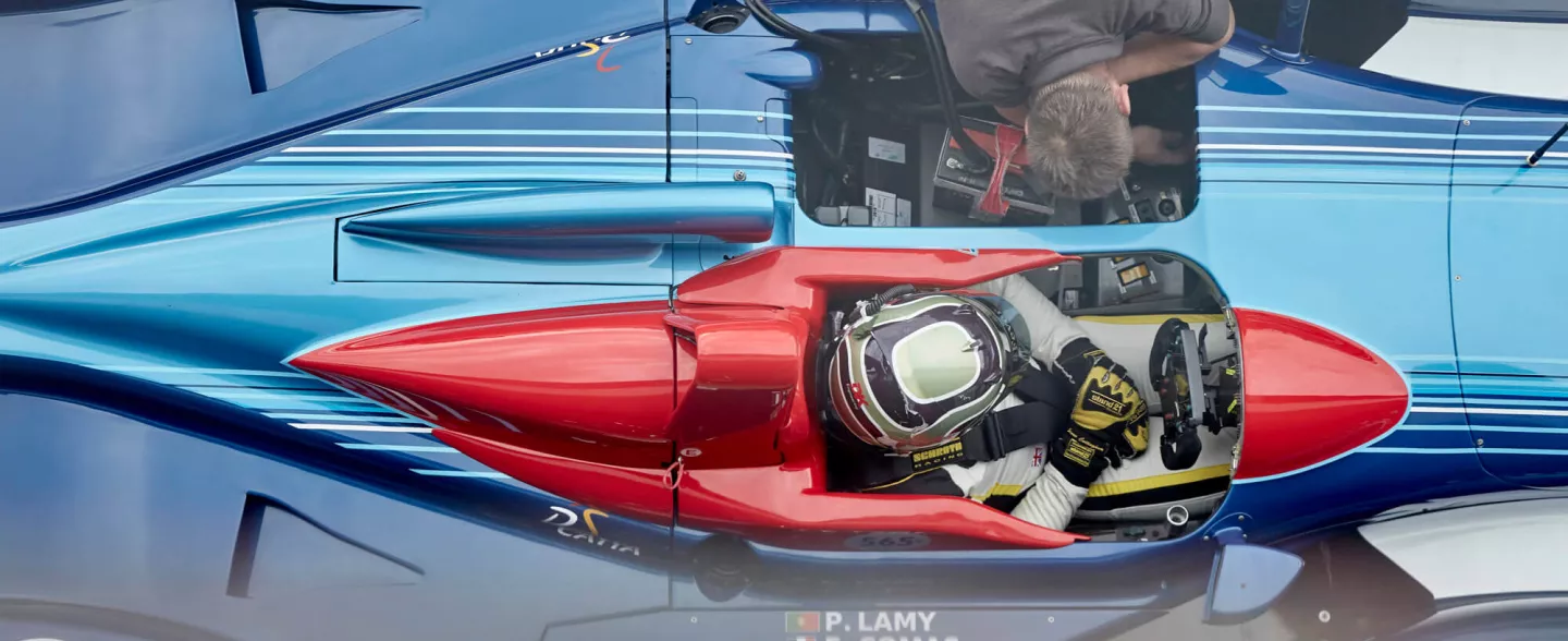 An ariel image of a competitor sat in his race car ready to take part in the Masters Endurance Legends grid at The Classic at Silverstone